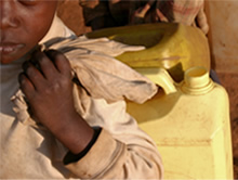 Boy Carrying Water Bottles.
