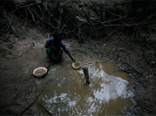 Girl Collecting Dirty Water.